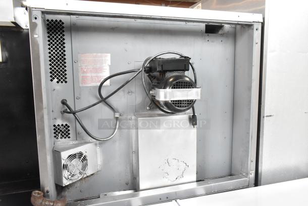 Blodgett stainless steel commercial gas convection oven interior, showing fan and electrical wiring. Features thermostatic controls.