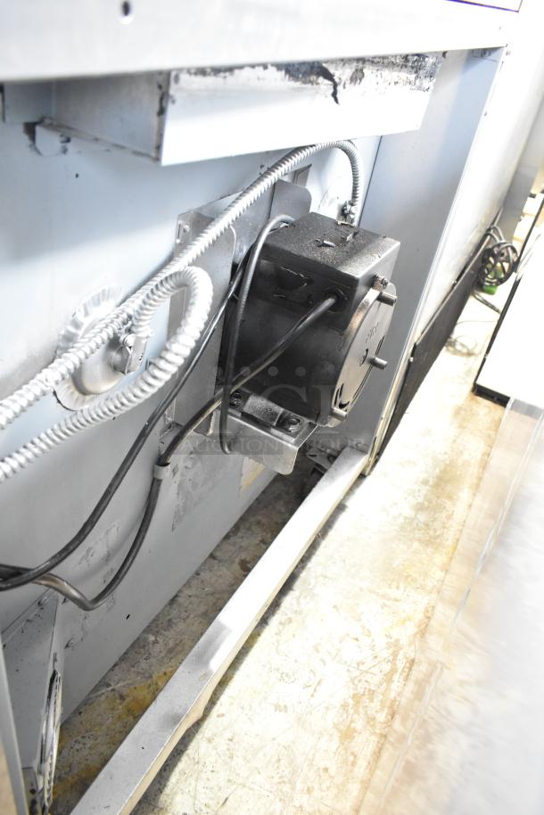 Blodgett stainless steel gas convection oven, commercial-grade, view-through doors, metal racks, thermostatic controls, on casters.