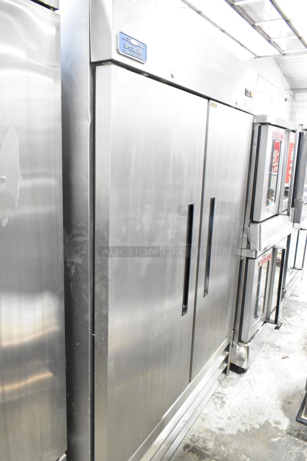 Arctic Air stainless steel 2-door commercial freezer, 115 volts, 1 phase, with visible brand logo on top.