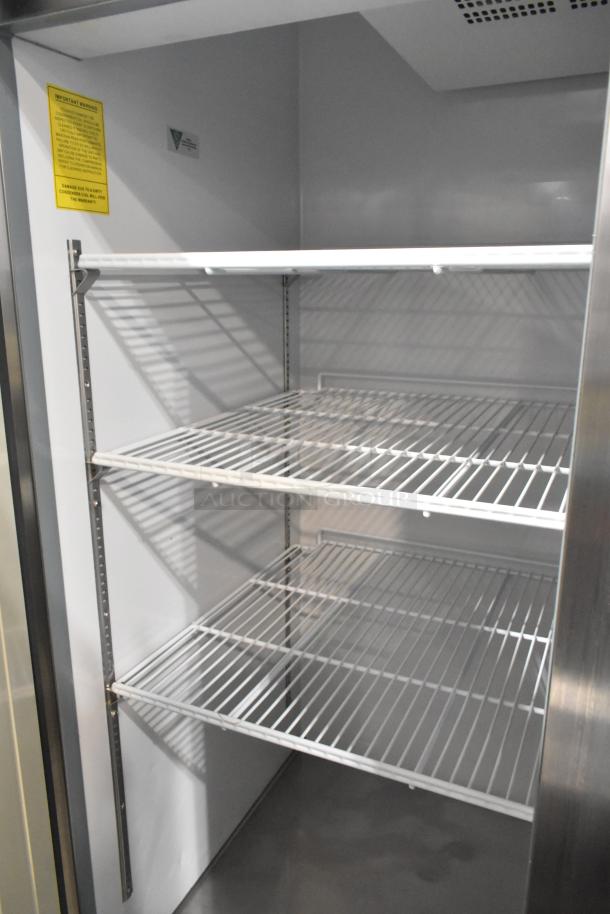 Arctic Air Stainless Steel 2 Door Commercial Freezer, with adjustable wire shelves, 115 volts, 1 phase, excellent condition.