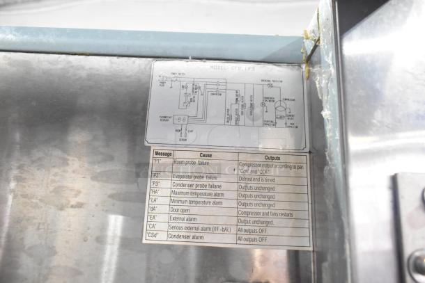 Arctic Air Stainless Steel Commercial 2 Door Reach In Freezer label showing wiring diagram and error codes for maintenance.