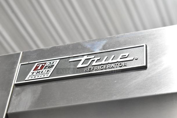 2017 True T-35 stainless steel 2-door reach-in cooler with logo. Includes poly-coated racks, commercial casters, 115V, 1 phase.