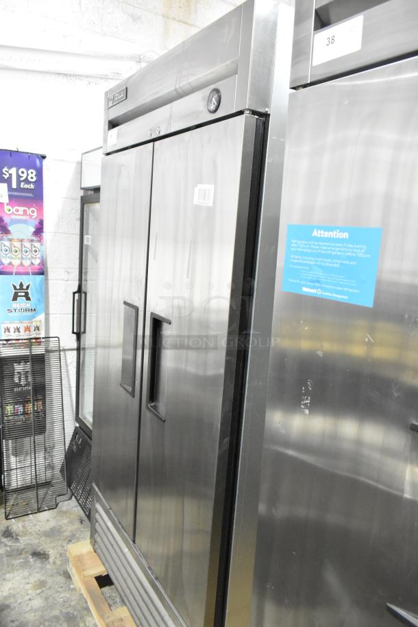 2017 True T-35 stainless steel commercial 2-door cooler with poly-coated racks, commercial casters, 115 volts, 1 phase.