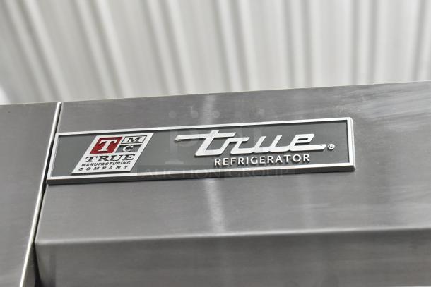2017 True T-35 stainless steel cooler, two doors, poly coated racks, commercial casters, 115V, 1 phase, logo detail.