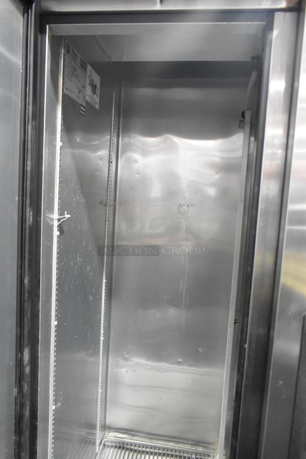 2017 True T-35 stainless steel commercial reach-in cooler, two doors, poly-coated racks, commercial casters, 115V, 1-phase.