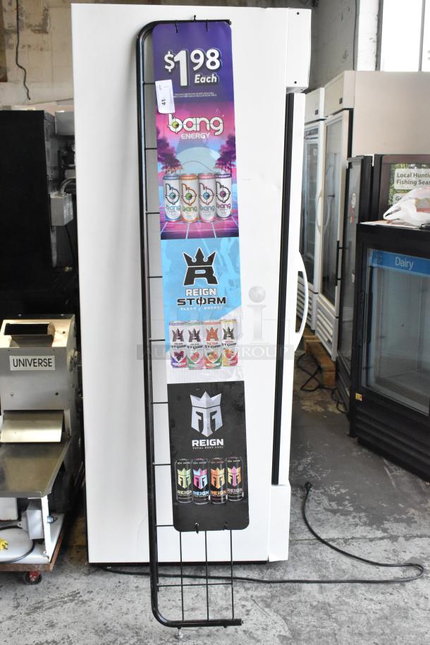 Tall vertical sign frame with energy drink advertisements, metal frame, good condition, text indicates $1.98 pricing.