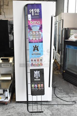 Tall vertical sign frame with energy drink advertisements, metal frame, good condition, text indicates $1.98 pricing.