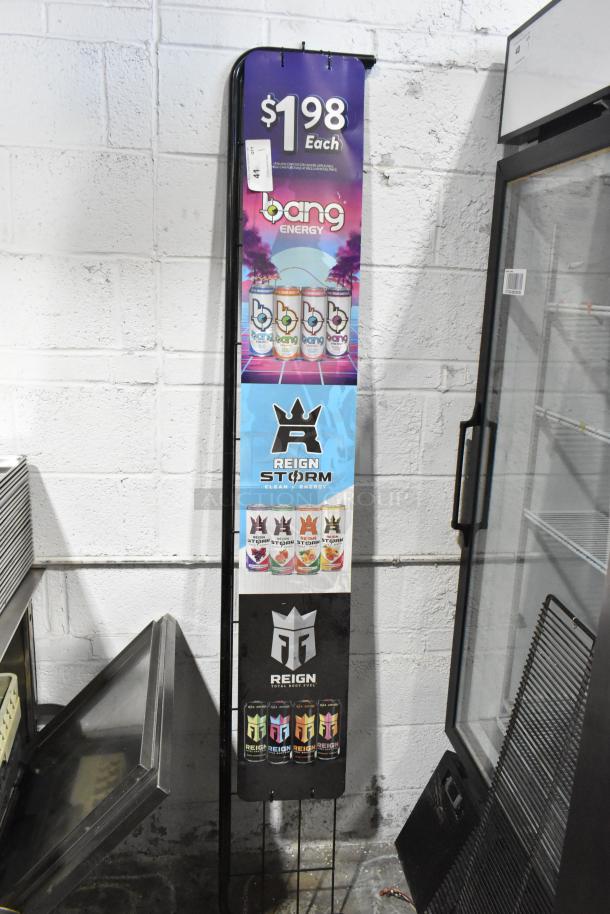 Metal sign frame displaying $1.98 Bang Energy and Reign Storm branding. Includes colorful product images. Good condition.