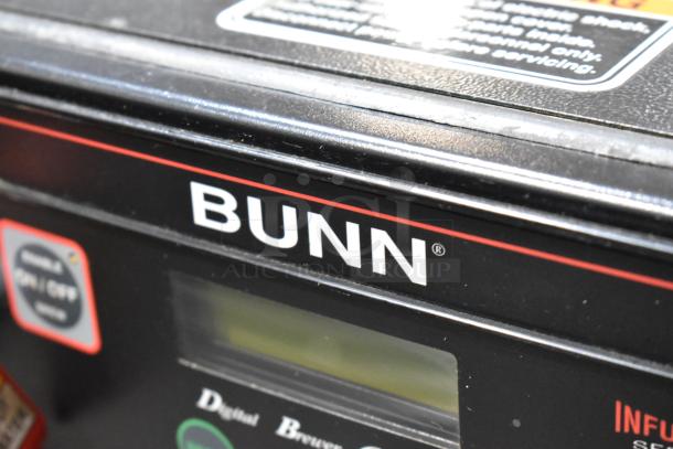 Bunn ITCB-DV metal commercial iced tea machine with hot water dispenser. Features digital controls, 120V. Excellent condition.