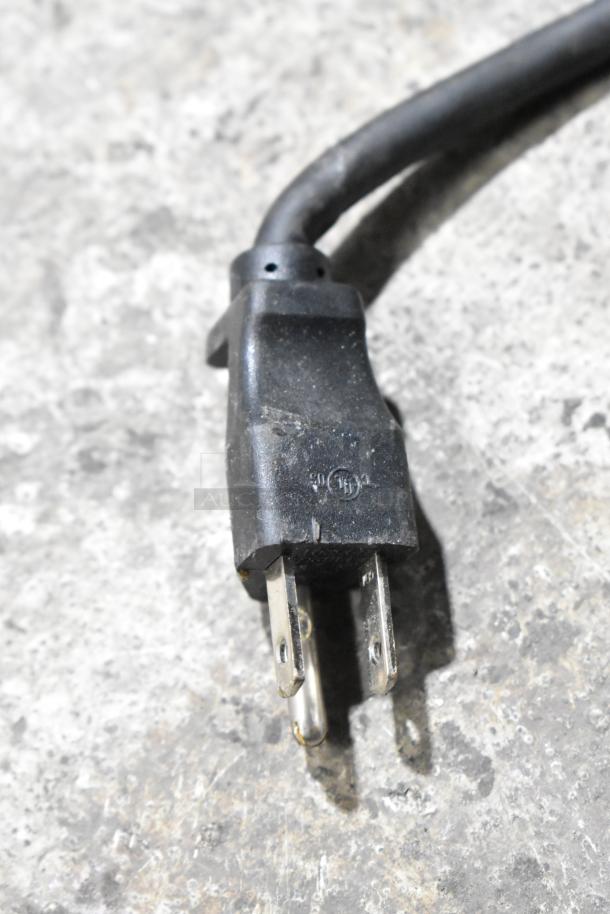 Close-up of a black three-prong power plug for the Bunn ITCB-DV iced tea machine.