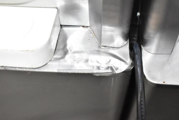 Beiqi BQ333 stainless steel soft serve ice cream machine close-up, showing minor dent on corner, 110V, floor-style.