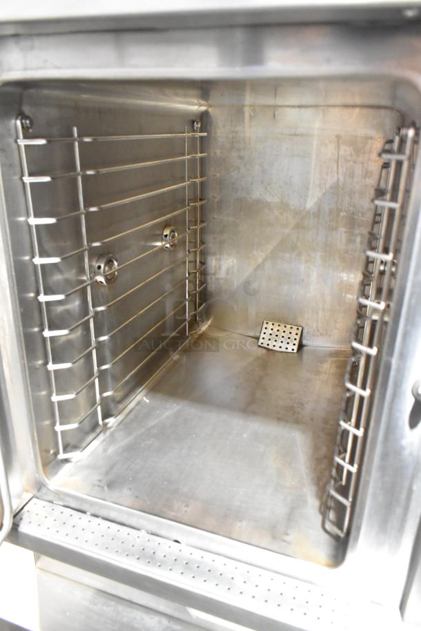Southbend GSX-10HE stainless steel commercial steam cabinet interior, showing dual rack design, clean condition.