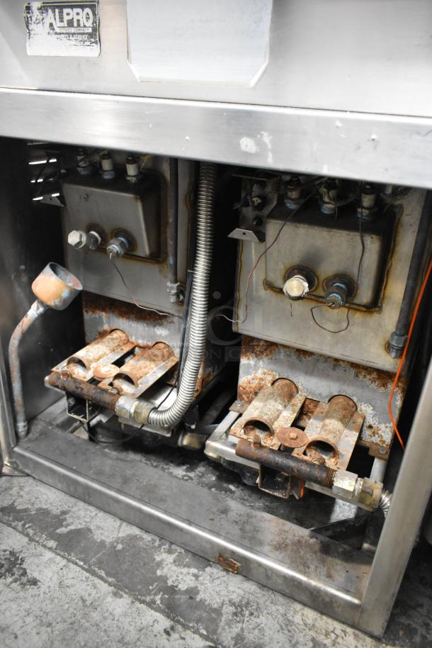 Southbend GSX-10HE steam cabinet interior, showing stainless steel construction and gas components, some rust present.