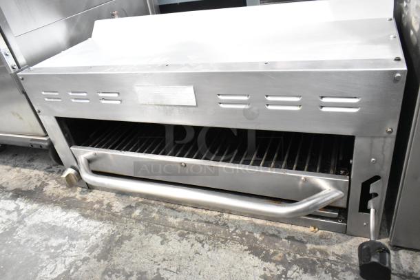 Standard Range stainless steel commercial cheese melter, features grill, good condition, brand label visible.