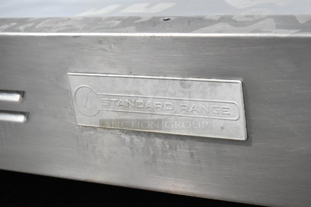 Standard Range stainless steel commercial cheese melter, visible label, minor wear, ideal for professional kitchens.