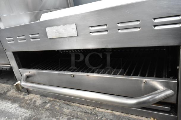 Stainless steel Standard Range commercial cheese melter with vented top, front handle, and brand logo. Ideal for professional kitchens.