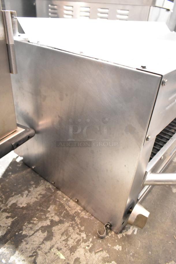 Standard Range stainless steel commercial cheese melter, showing side panel and sturdy construction, in good condition.