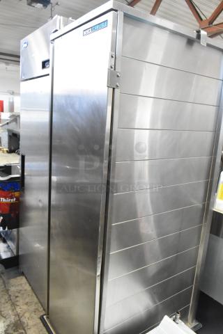Dinex Carlisle ICTPT-24 metal commercial pan transport rack with enclosed design on heavy-duty casters, excellent condition.