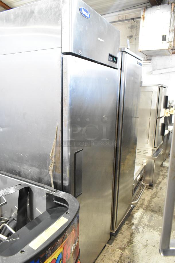 2021 Atosa MBF8001GR stainless steel single door freezer with poly-coated racks and commercial casters; 115 volts, 1 phase.
