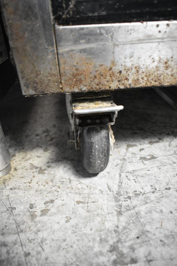 2021 Atosa MBF8001GR stainless steel freezer on caster showing signs of rust; commercial-grade, 115V, 1 phase.