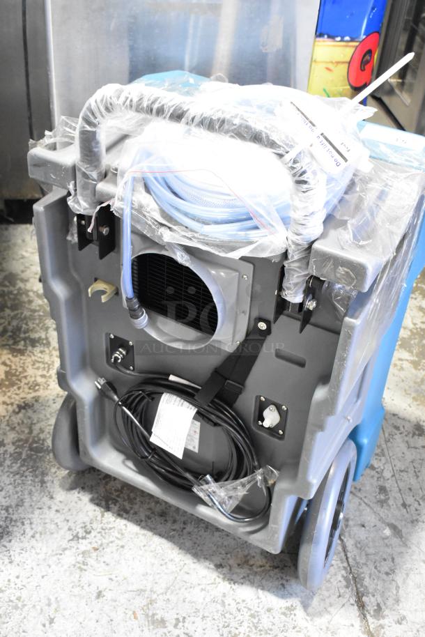 2024 Boltic 22BPCD130P Dehumidifier, 115V, 1 Phase, in new condition with plastic wrapping, showing hoses and cables.