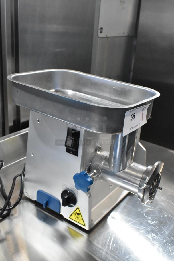Edlund EDVG-12A metal commercial countertop meat grinder, 120 volts, 1 phase. Features dial controls and outlet attachments.