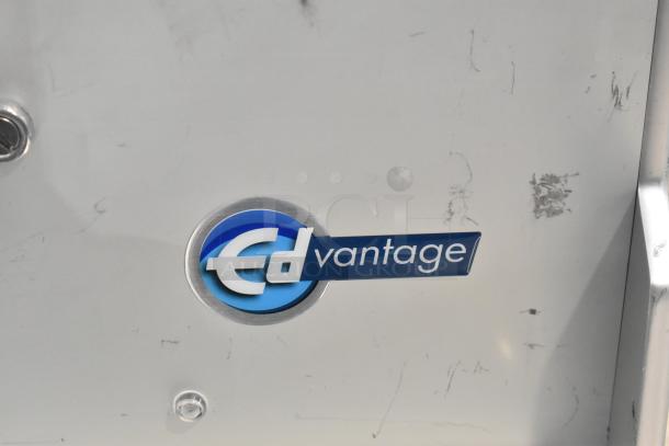 Edlund EDVG-12A metal commercial countertop meat grinder, 120V, 1 Phase, logo and scratches visible on surface.