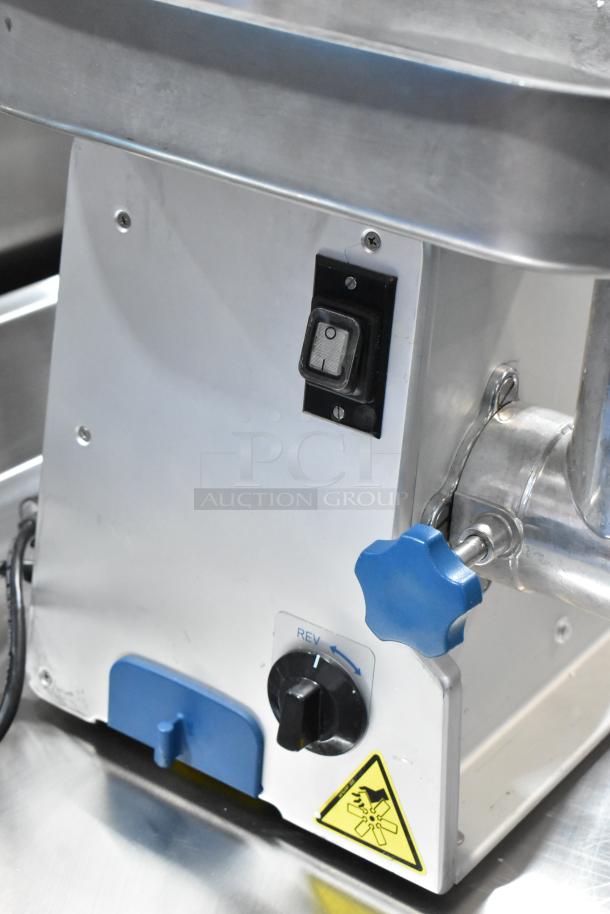 Edlund EDVG-12A metal commercial countertop meat grinder, featuring a power switch, blue knobs, and caution label. 120V, 1 phase.