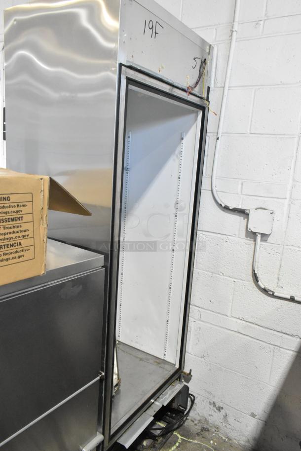 True T-19F stainless steel single door freezer. Door detached, 115V, 1 phase. Model and condition visible.