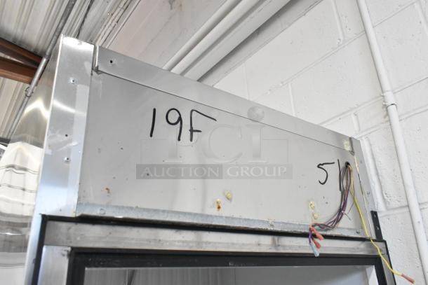 True T-19F stainless steel freezer with detached door. Visible wiring and markings. Requires repair. 115V, 1 Phase.