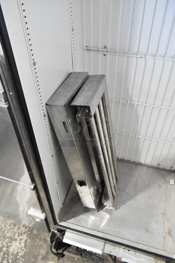 True T-19F stainless steel commercial freezer, single door, needs reattachment. 115 volts, 1 phase. Interior view.