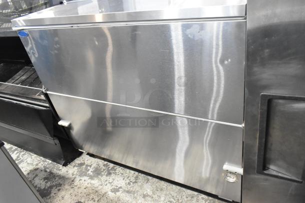Norlake AR122SSS/0-A stainless steel commercial milk cooler with casters, 208-230V, 1 phase.