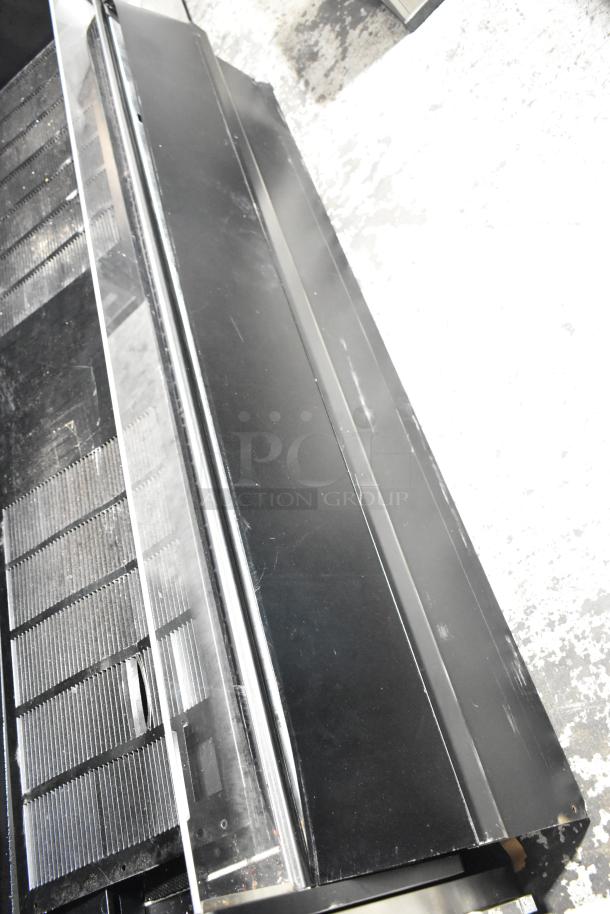 Federal Industries ESSRC7752 black metal air curtain merchandiser, convertible top, 208-240V, minor surface wear.