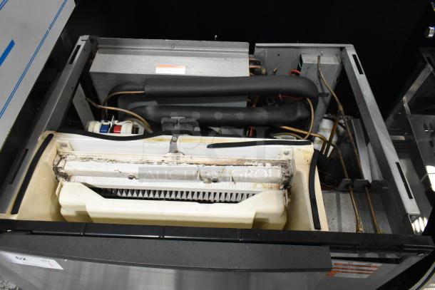 Manitowoc SY1204A stainless steel commercial ice head, 208-230V, 1 phase, detailed internal view, showing components.
