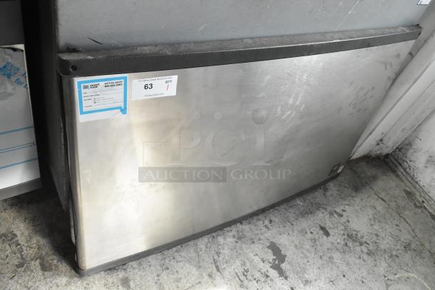Manitowoc QY1305W metal commercial ice head on bin, 208-230V, 1 Phase. Visible label indicates model and auction details.