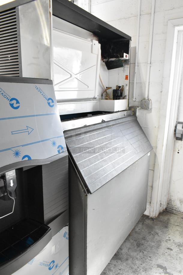 Manitowoc QY1305W commercial ice head with bin, metal body, 208-230V, 1 phase, visible branding, used condition.