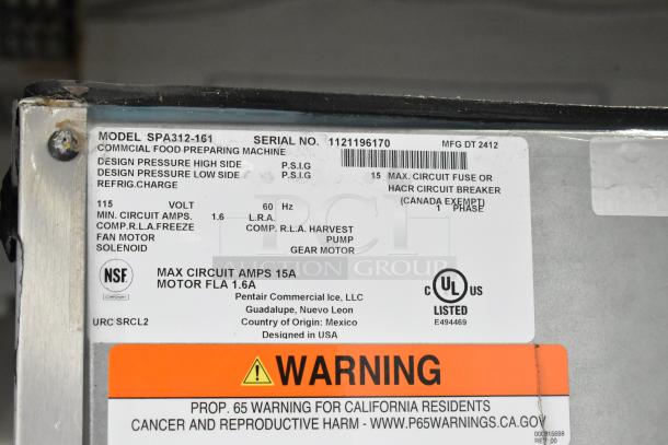 Label on a 2024 Manitowoc SPA312-161 stainless steel commercial touchless hotel ice dispenser, showing specifications and safety warnings.