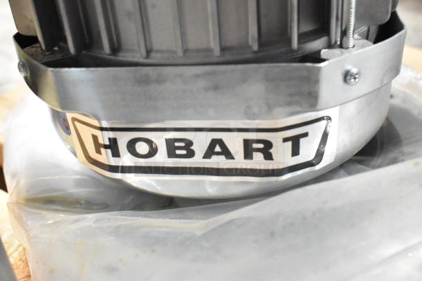 Brand new Hobart FD4/150-1 garbage disposer, 1 1/2 hp, model 425FD41501, visible logo, scratch and dent condition.