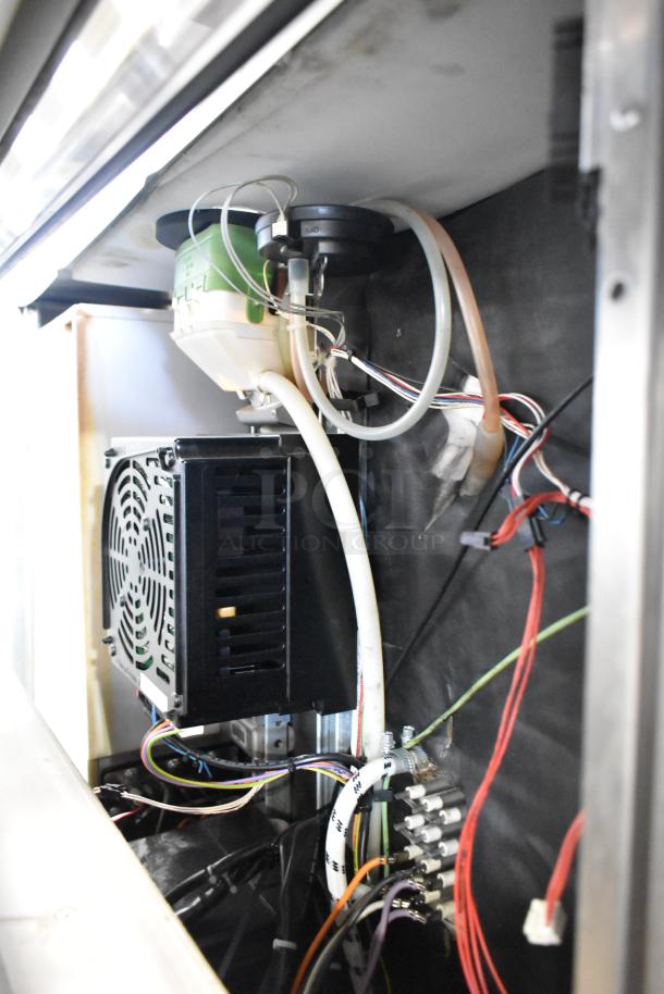Interior view of a 2021 Rational LM100EE.AXXXX stainless steel iCombi Pro convection oven showing wiring and components.