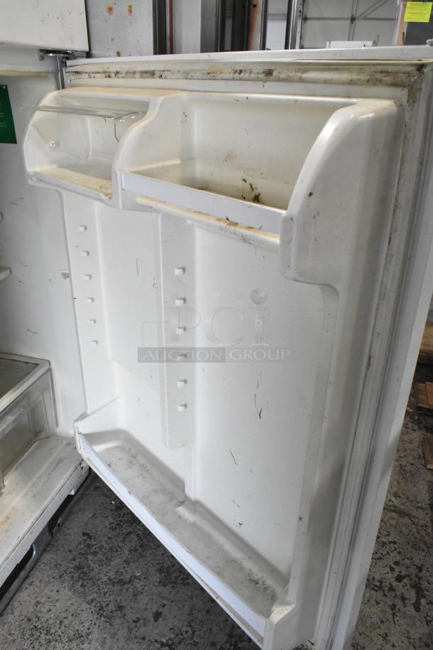 Maytag M1TXEGMYW00 metal reach-in cooler with freezer, 115 volts, visible interior condition, some wear and marks.