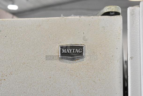 Maytag M1TXEGMYW00 reach-in cooler, metal finish with freezer, 115 volts, 1 phase, Maytag logo visible, shows wear.