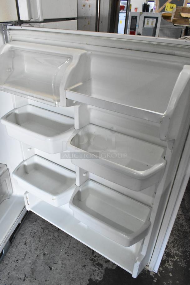 Maytag M1TXEGMYW00 metal reach-in cooler with freezer. Interior view showing shelves and compartments, 115 volts, 1 phase.