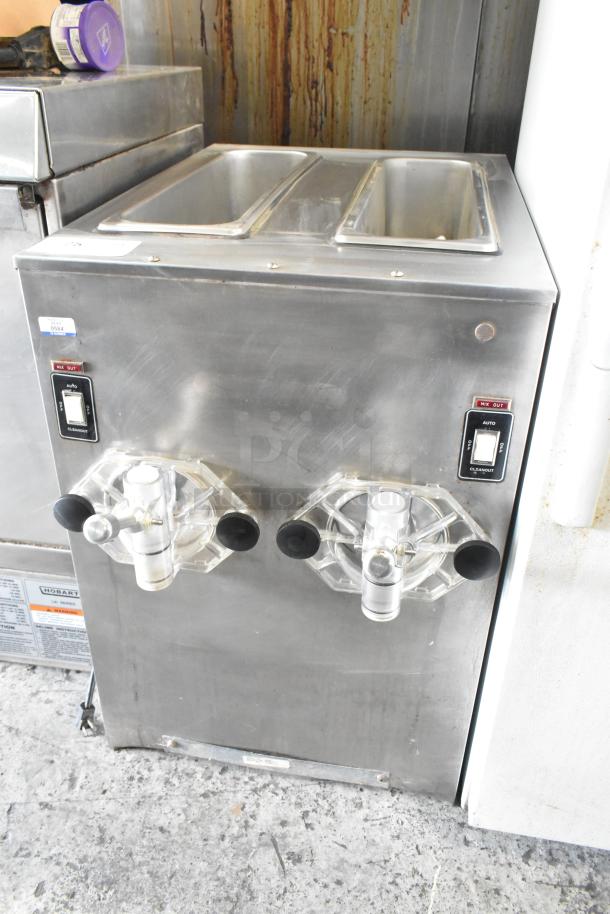 SaniServ A7581E commercial countertop 2-flavor frozen beverage machine in stainless steel. 115 volts, 1 phase.