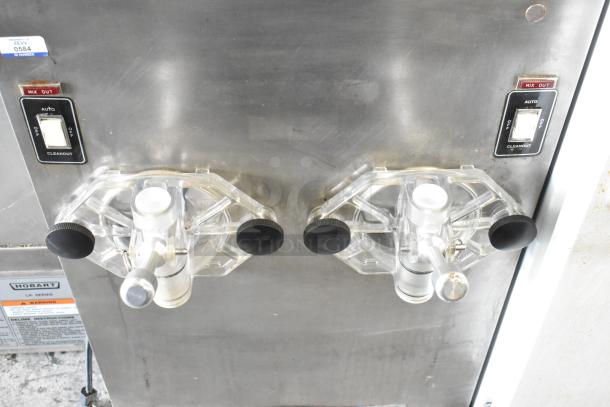 SaniServ A7581E stainless steel countertop 2-flavor frozen beverage machine, 115 volts, 1 phase, in commercial use condition.