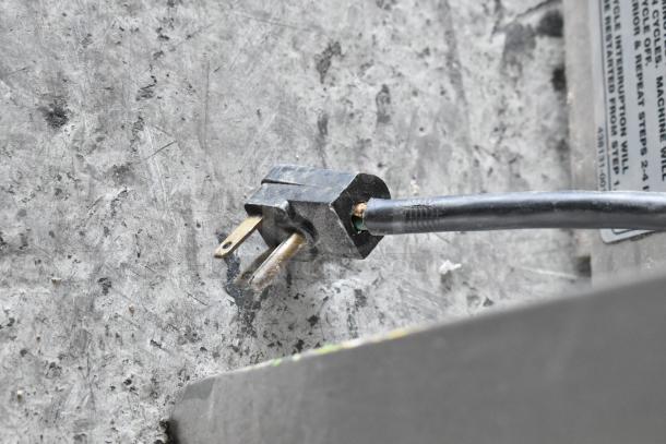 SaniServ A7581E plug detail; commercial 2-flavor frozen beverage machine, stainless steel, 115 volts, 1 phase.