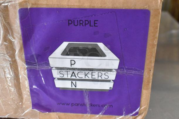 Two boxes of purple Pan Stackers, unopened, with label showing stackable design and website link.