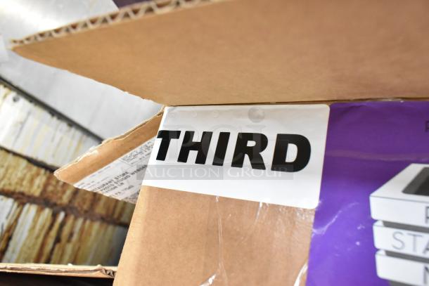 Two boxes labeled "Third" containing Purple Pan Stackers, visible packaging. Auction doubles winning bid quantity.