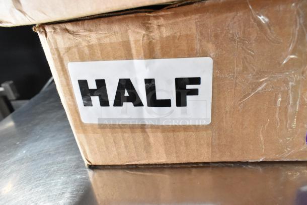Two boxes labeled "Half" containing Purple Pan Stackers, visible cardboard packaging, likely unopened and intact.