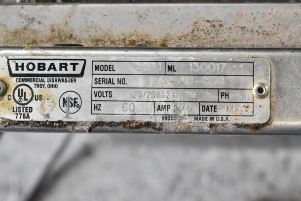 Hobart LXIH commercial dishwasher label, showing model and serial number, voltage specs, and certifications. Rust visible.