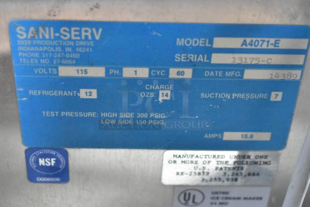 SaniServ A4071-E stainless steel soft serve ice cream machine label. Shows model, volts, refrigerant charge, and specs.